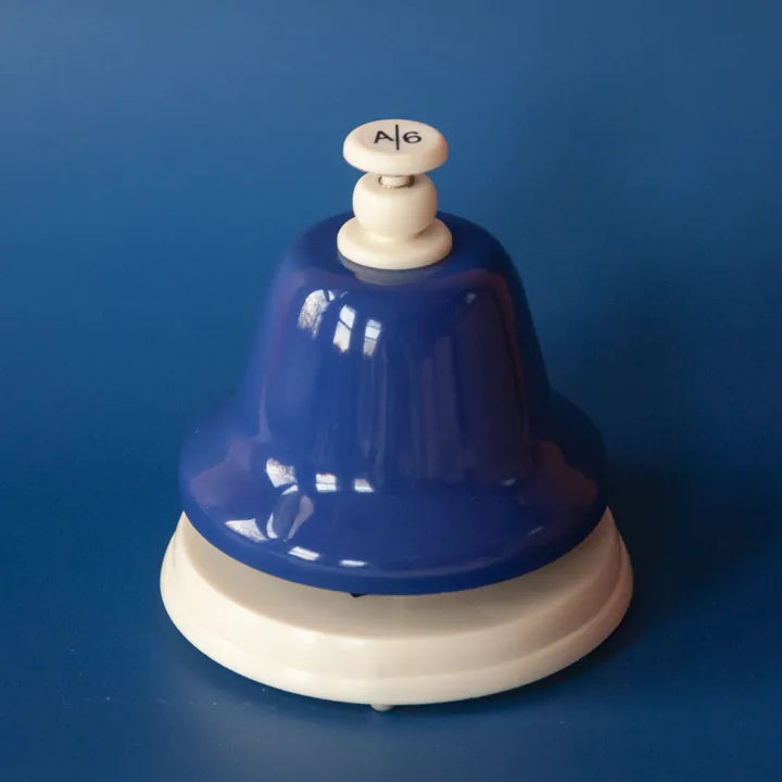 The indigo A deskbell on an indigo background