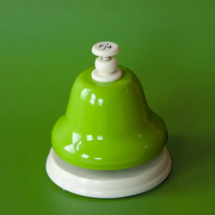 The green F deskbell on a green background